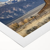 Rolled canvas artwork showcasing a vibrant landscape scene with a rustic barn, featuring rich colors and textures, elegantly packaged in a durable cardboard tube for safe delivery. Ideal for adding a touch of rural charm to home decor.