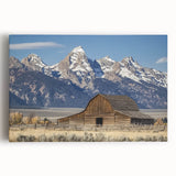 Stretched canvas artwork showcasing a vibrant landscape of a rustic barn against a serene countryside backdrop, perfect for home décor or art enthusiasts.