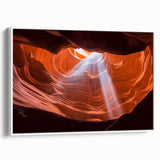 Framed landscape canvas artwork showcasing vibrant canyons in rich earth tones, displayed against a white wall, enhancing home decor with a natural theme.