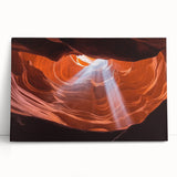 Stretched canvas artwork depicting a stunning landscape of canyons at sunset, featuring vibrant orange, red, and purple hues, ideal for home decor enthusiasts.