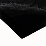 Large art of a black and white landscape painting on stretched canvas, featuring a close-up view of natural elements.