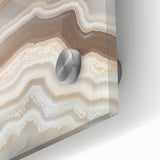 Large abstract wall art depicting nature elements in muted green and brown tones on acrylic glass.