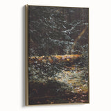 Framed canvas featuring a vintage-style landscape painting of fall, with muted gold and black tones.