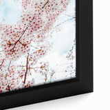 Close-up of a framed canvas featuring black textured art with vibrant spring-themed colors, ideal for living room decor.