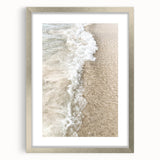 Textured art abstract print in cool blue and silver tones, framed in silver, ideal for modern bedroom ambiance.