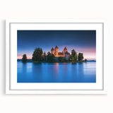 Elegant framed landscape artwork depicting a majestic castle surrounded by lush greenery, showcased with a white mat, perfect for home decor or gallery display.