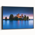 Framed canvas artwork showcasing a stunning landscape of a majestic castle, set against a vibrant blue sky. The black frame adds a modern touch, perfect for home decor.