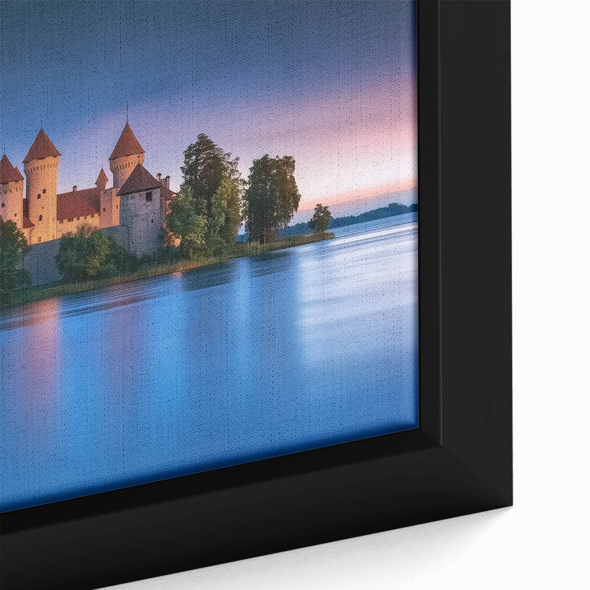 Close-up of a framed canvas artwork depicting a serene landscape with a majestic castle surrounded by lush greenery, showcasing vibrant colors and intricate details. Perfect for enhancing home decor with a touch of elegance.