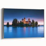 Framed canvas artwork depicting a scenic landscape with a majestic castle, set against a vibrant sky. The piece features a sleek silver frame, perfect for enhancing home decor.