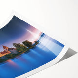 Rolled print showcasing a vibrant landscape featuring a majestic castle surrounded by lush greenery and a clear blue sky, perfect for home decor.