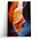 Stretched canvas artwork depicting a serene landscape with caves, featuring earthy tones and intricate details, perfect for home decor or artistic display.