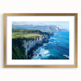 Elegant gold-framed landscape print showcasing dramatic cliffs and vibrant colors, perfect for enhancing home decor with a touch of nature's beauty.