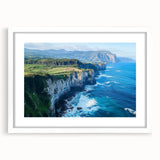Framed landscape artwork showcasing dramatic cliffs in vibrant colors, featuring a sleek white mat and contemporary frame, perfect for modern home decor.
