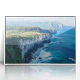 Framed acrylic landscape artwork depicting dramatic cliffs in vibrant colors, set in a sleek white frame, perfect for enhancing modern home decor.