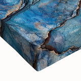 Close-up of a stretched canvas artwork depicting vibrant, abstract canyons in earthy tones, highlighting intricate textures and details, perfect for home décor.