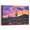 Framed canvas artwork displaying a stunning desert landscape with vibrant colors, featuring a sleek black frame. Ideal for home decor and art enthusiasts.