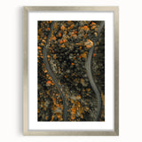 Textured abstract art print in warm autumn hues on a silver-framed canvas, ideal for bedroom wall decor.