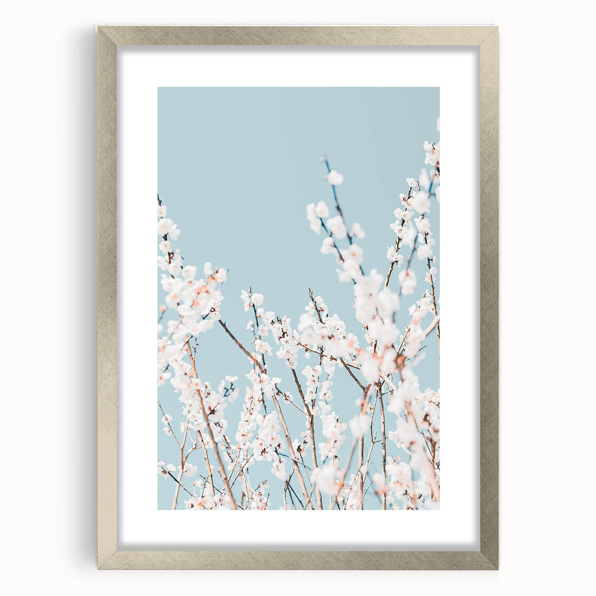 Textured abstract art print with soft green and pink hues on a silver-framed canvas, suitable for bedroom decor.