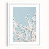 Abstract art print featuring swirling pastel hues on a white-framed canvas, ideal for bedroom or dining room decor.