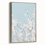 Framed canvas depicting a vintage landscape painting with lush greenery and soft blue skies, ideal for bedroom wall art.