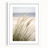 Abstract art print featuring swirling blue and green patterns on a white framed canvas, ideal for dining room decor.