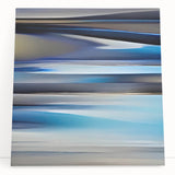 Abstract wall art featuring vibrant, multicolored strokes on a stretched canvas, elegantly leaning against a neutral wall, adding a modern touch to home decor.