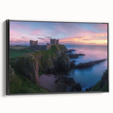 Framed canvas artwork depicting a picturesque landscape with a castle, set against a serene backdrop, featuring a sleek black frame and side view for elegant display.