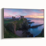 Framed canvas artwork displaying a picturesque landscape with a majestic castle, featuring a sleek silver frame, ideal for enhancing home decor.