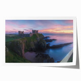 Rolled print showcasing a vibrant landscape featuring a majestic castle surrounded by lush greenery and a serene sky, perfect for home decor.