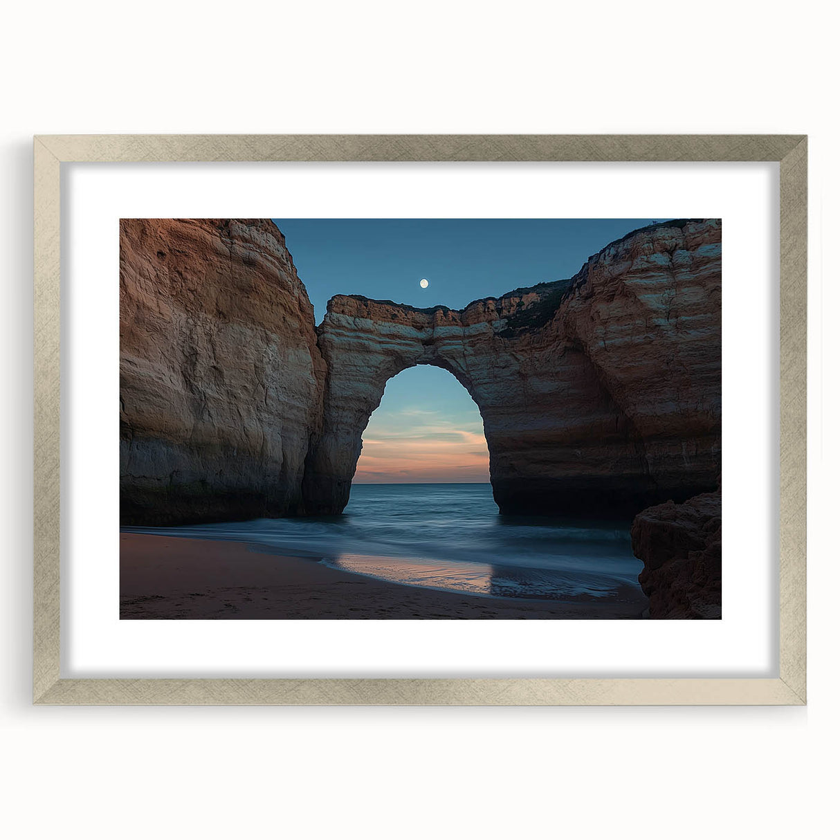 Framed landscape artwork featuring dramatic cliffs and ocean views, presented in a sleek silver frame with a white mat, perfect for enhancing home decor.