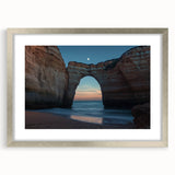 Framed landscape artwork featuring dramatic cliffs and ocean views, presented in a sleek silver frame with a white mat, perfect for enhancing home decor.