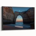 Framed canvas artwork depicting a stunning landscape of rugged cliffs with a serene ocean view, featuring a sleek black frame that enhances the visual impact, ideal for modern home decor.