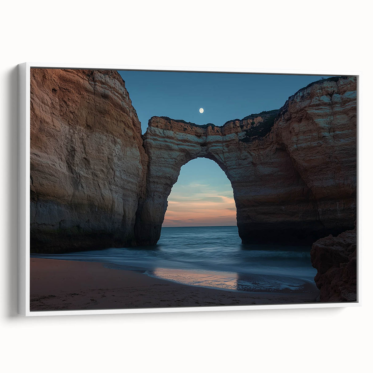 Framed canvas artwork showcasing a stunning landscape of rugged cliffs and serene ocean waves, featuring a white frame that enhances its modern aesthetic. Perfect for home decor.