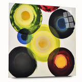 Abstract geometric acrylic glass artwork showcasing vibrant colors and intricate patterns, viewed from the side, emphasizing its modern design and smooth finish. Ideal for contemporary decor.
