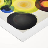 Abstract geometric rolled canvas art featuring vibrant blue, yellow, and orange shapes, ideal for modern home decor, packaged securely for shipping.