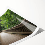 Rolled print showcasing a vibrant landscape bridge design, featuring lush greenery and a serene river, packaged securely in a protective cardboard tube. Ideal for home decor.