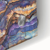 Close-up of an acrylic glass artwork showcasing vibrant landscape canyons with rich colors and intricate details, perfect for modern home decor.