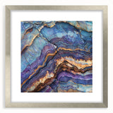 Framed landscape artwork showcasing a stunning canyon scene in vibrant colors, encased in a sleek silver frame with a white mat for an elegant presentation. Perfect for home decor enthusiasts looking to enhance their space with natural beauty.