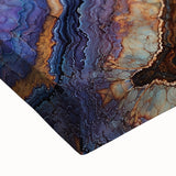 Close-up of a textured stretched canvas depicting a vibrant landscape of colorful canyons, showcasing rich earth tones and intricate details, perfect for home decor.