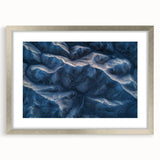 Framed desert landscape artwork in a silver frame with a mat, showcasing vibrant colors and intricate details, ideal for enhancing modern home decor.