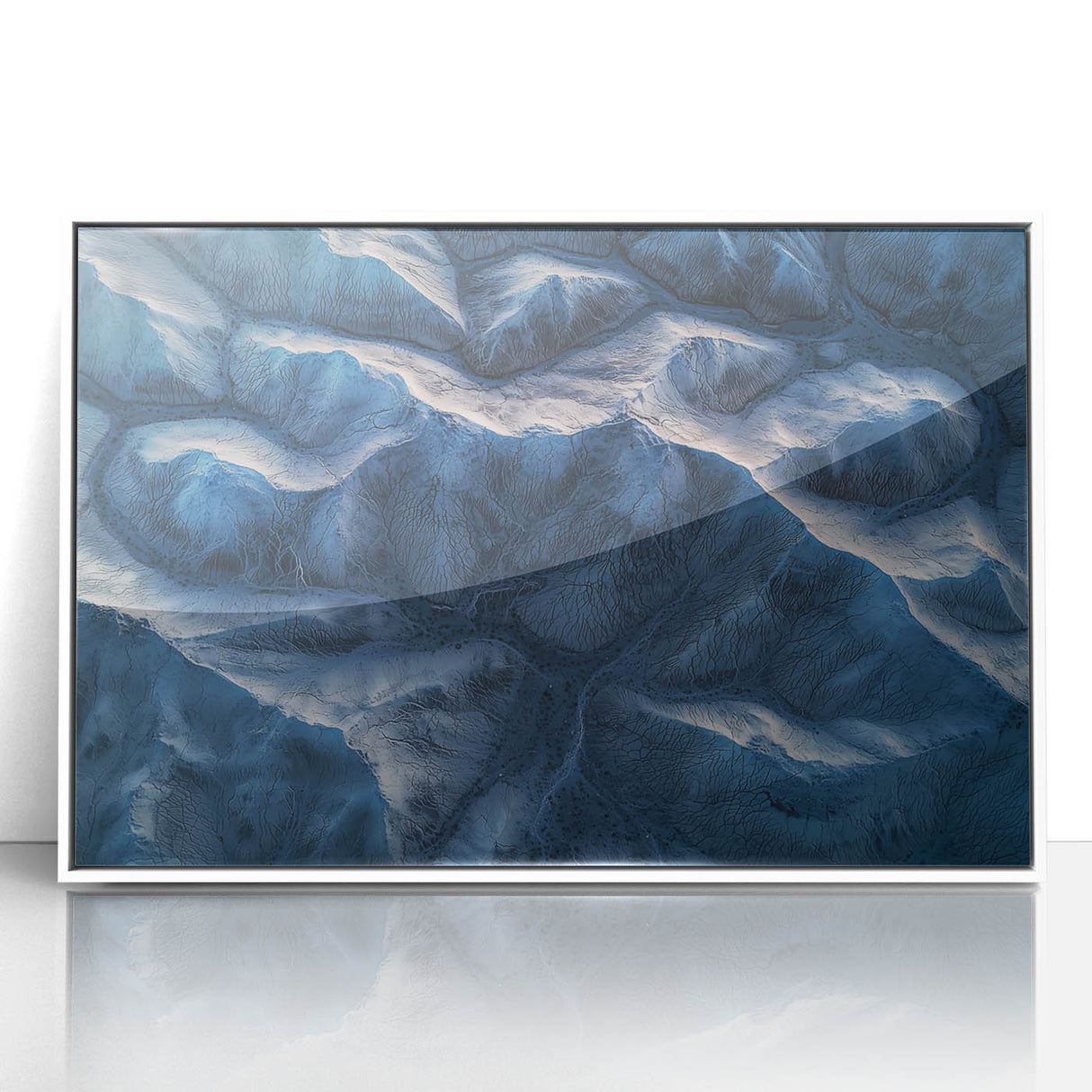 Framed acrylic landscape art depicting a serene desert scene with warm tones and intricate details, showcased in a stylish white frame, perfect for modern decor.
