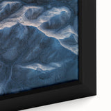 Close-up of a framed canvas depicting a vibrant desert landscape with warm tones of orange and brown, showcasing intricate details and textures that evoke serenity. Perfect for home decor, this artwork enhances living spaces with a touch of nature's beauty.