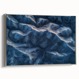 Framed canvas artwork depicting a serene desert landscape in warm hues, featuring a silver frame that enhances its modern aesthetic. Ideal for home decor.