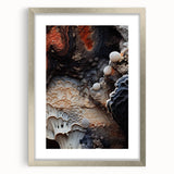 Textured abstract art print in a silver frame with a mat, featuring swirls in earth tones, ideal for bedroom decor.