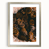 Textured abstract art print in warm autumn hues on a silver-framed canvas, ideal for bedroom ambiance.