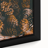Close-up of a framed canvas depicting a textured, abstract design in black with colorful accents.