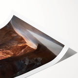 Rolled print showcasing a vibrant landscape scene with caves, featuring rich colors and intricate details, expertly packaged in a protective cardboard tube for delivery.