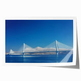 Rolled canvas print showcasing a stunning landscape bridge design, featuring vibrant colors and intricate details, packaged securely in a protective cardboard tube.