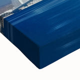 Close-up of a stretched canvas artwork depicting a serene landscape bridge scene with vibrant colors and intricate details, perfect for home decor.