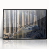 Framed acrylic artwork depicting a stunning landscape of canyons, showcasing rich earthy tones of red and brown, set against a black frame to enhance its depth. Ideal for home decor enthusiasts looking to elevate their space with nature-inspired art.